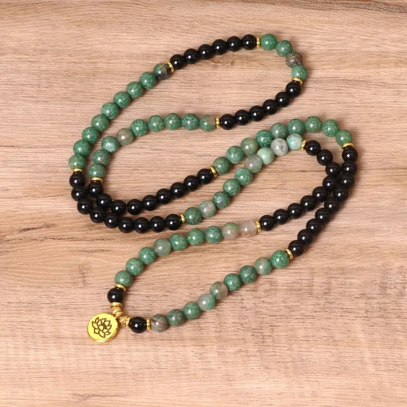 Green and black alloy beaded elastic bracelet with stretch band on wrist