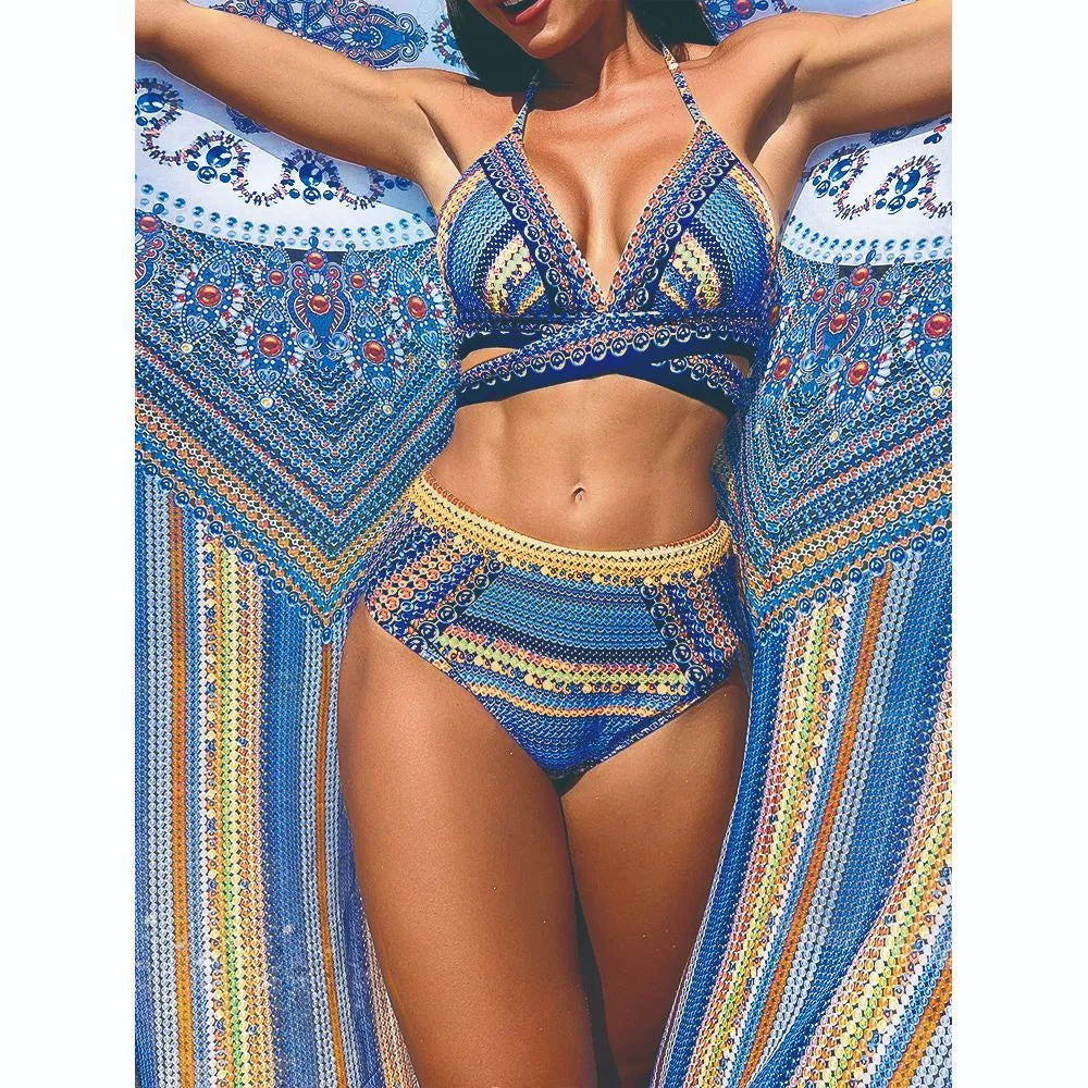 Blue cross bandage bikini top with high-waisted bottoms and matching smock cover-up.