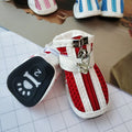 Four blue cloth dog shoes for small dogs with front zipper closure on a white background.