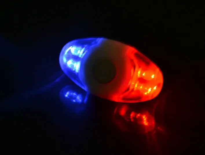 Red and blue LED tail light with adjustable base for cycling safety