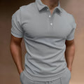 Men's grey loose fit button-down short sleeve t-shirt on a hanger.