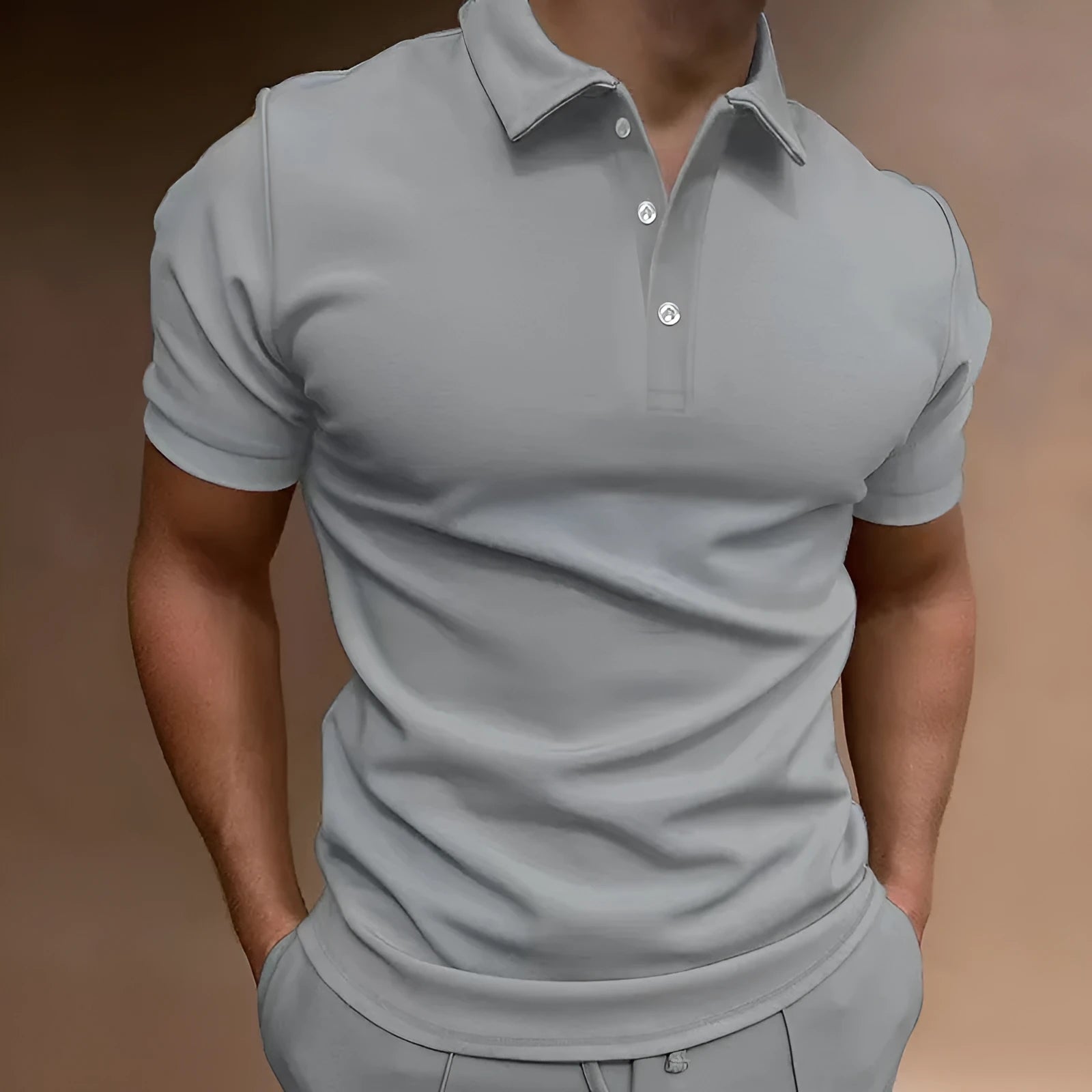 Men's grey loose fit button-down short sleeve t-shirt on a hanger.