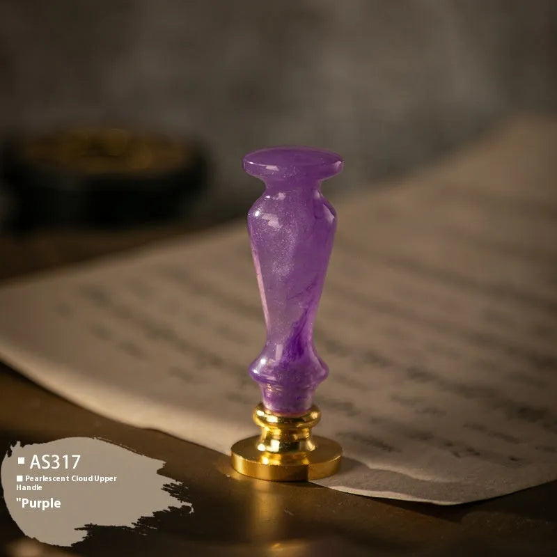 Wooden wax seal handle in a selection of different colour and decorative finishes.