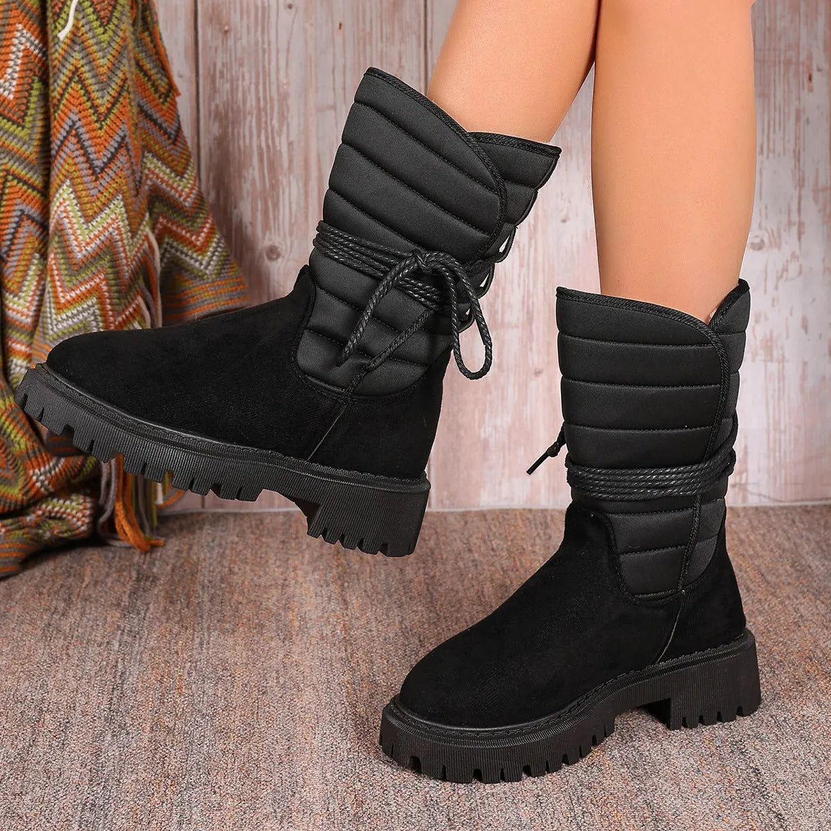 Women's black suede snow boots with chunky heel, lace-up front and fleece lining