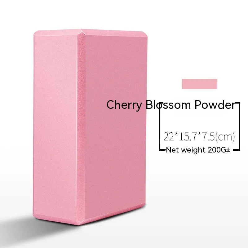 High-density EVA yoga block in violet colour next to a pink block with a cartoon print design.