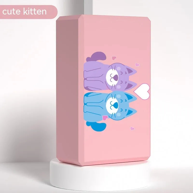 High-density EVA yoga block in violet colour next to a pink block with a cartoon print design.
