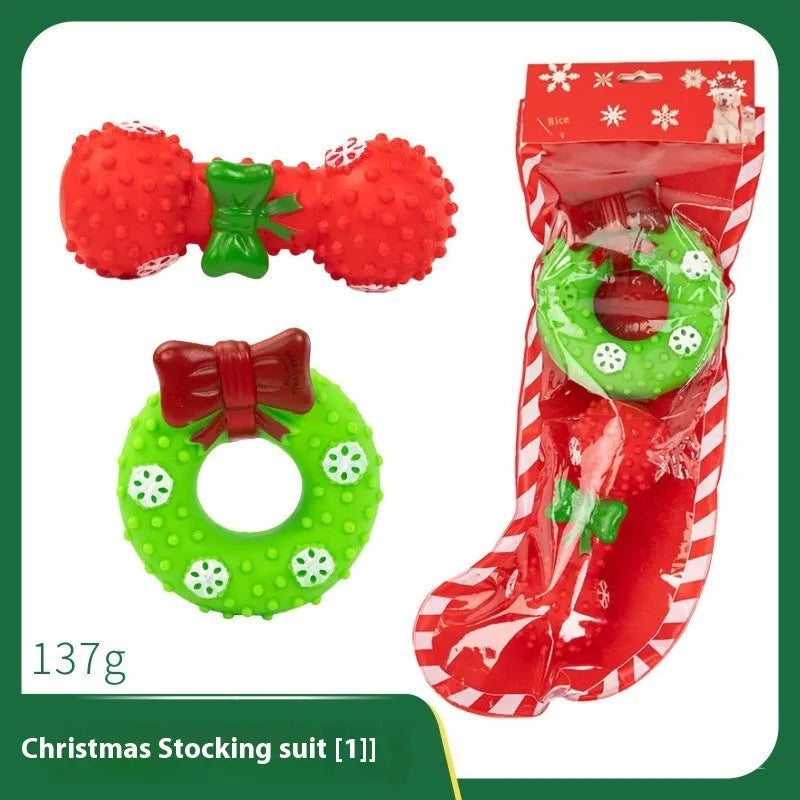 Set of colourful Christmas-themed vinyl dog chew toys including balls, ropes, and Santa figures.