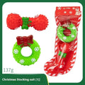 Set of colourful Christmas-themed vinyl dog chew toys including balls, ropes, and Santa figures.