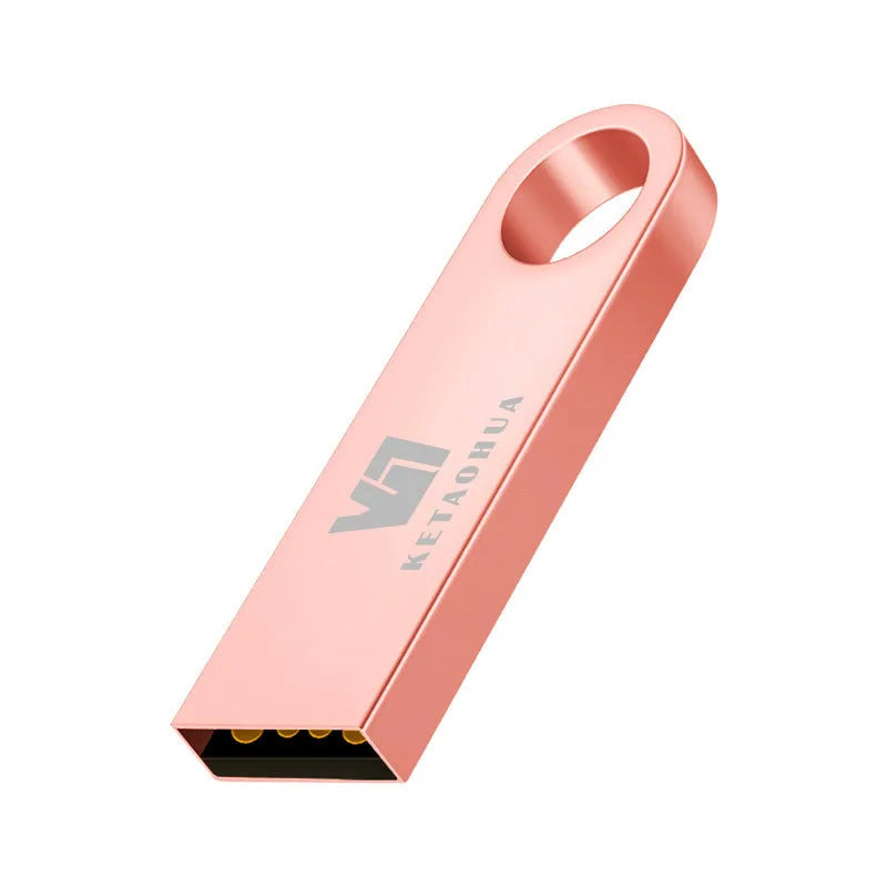 Silver metal car-shaped USB flash drive on a white background, showing USB connector.