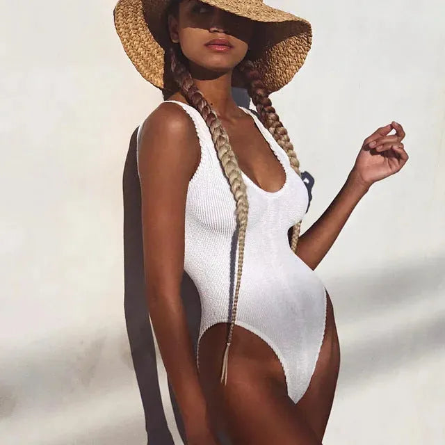 Solid color bubble cloth wrinkled one-piece swimsuit with backless design and high elasticity in black, pink, lake green, or white