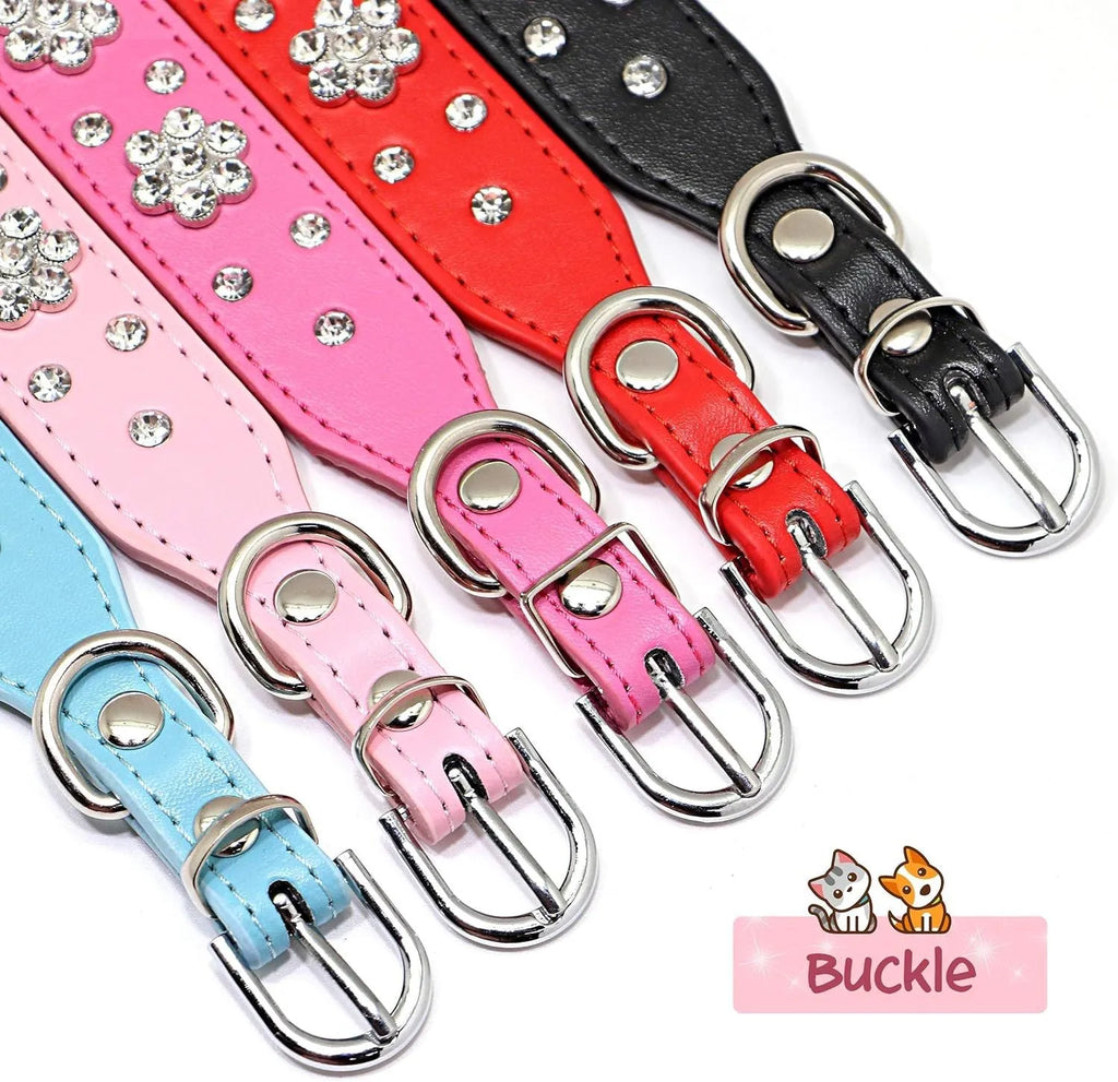 Close-up of a black PU leather dog collar with sparkling rhinestone flowers and a metal D-ring.