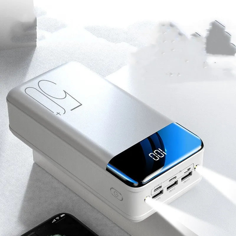 Black and white 50000mAh power bank with three USB output ports showing dimensions 169x83x52mm