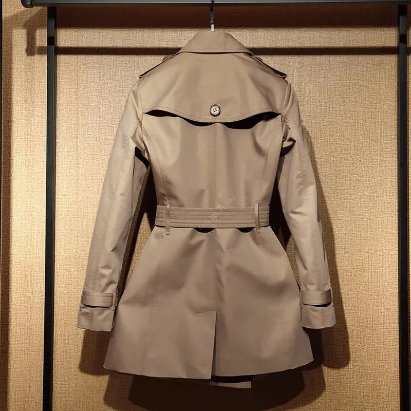 Khaki women's trench coat with double-breasted button front and flight sleeves