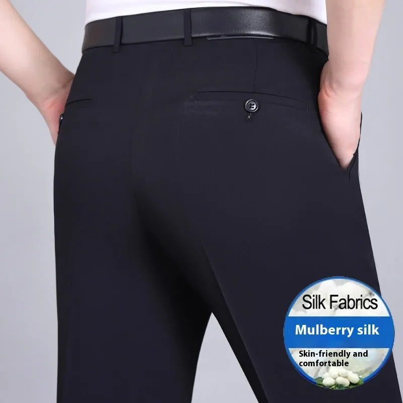 Men's straight-leg mulberry silk blend dress trousers in black on a hanger