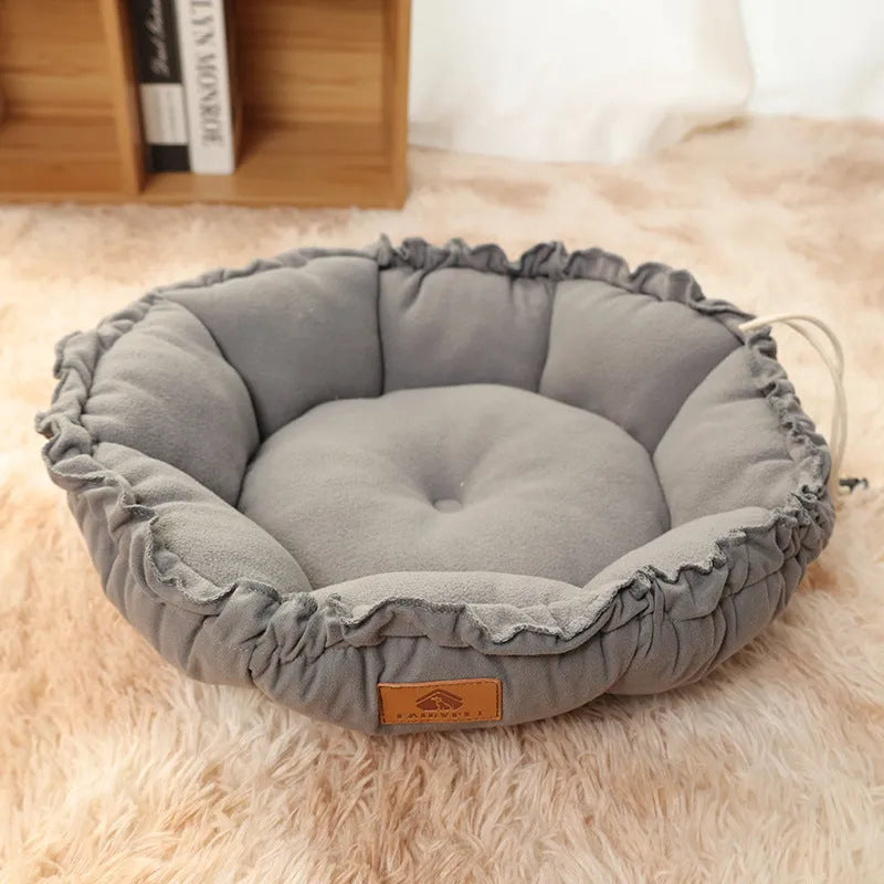Grey and green reversible donut-shaped cat bed with plush fabric and non-slip base