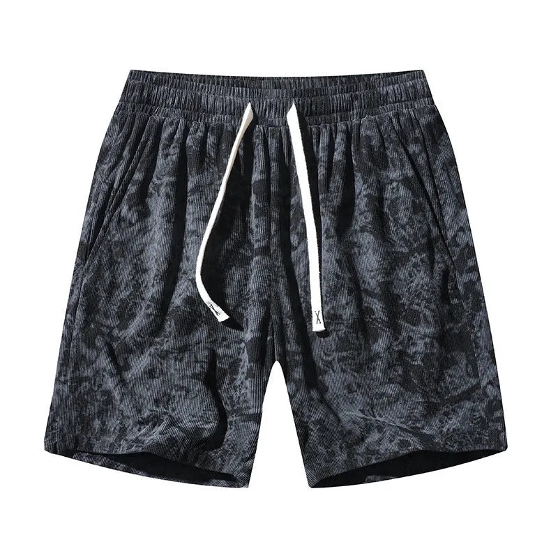 Men's camouflage pattern corduroy shorts with an elasticated high waistband on a plain background.