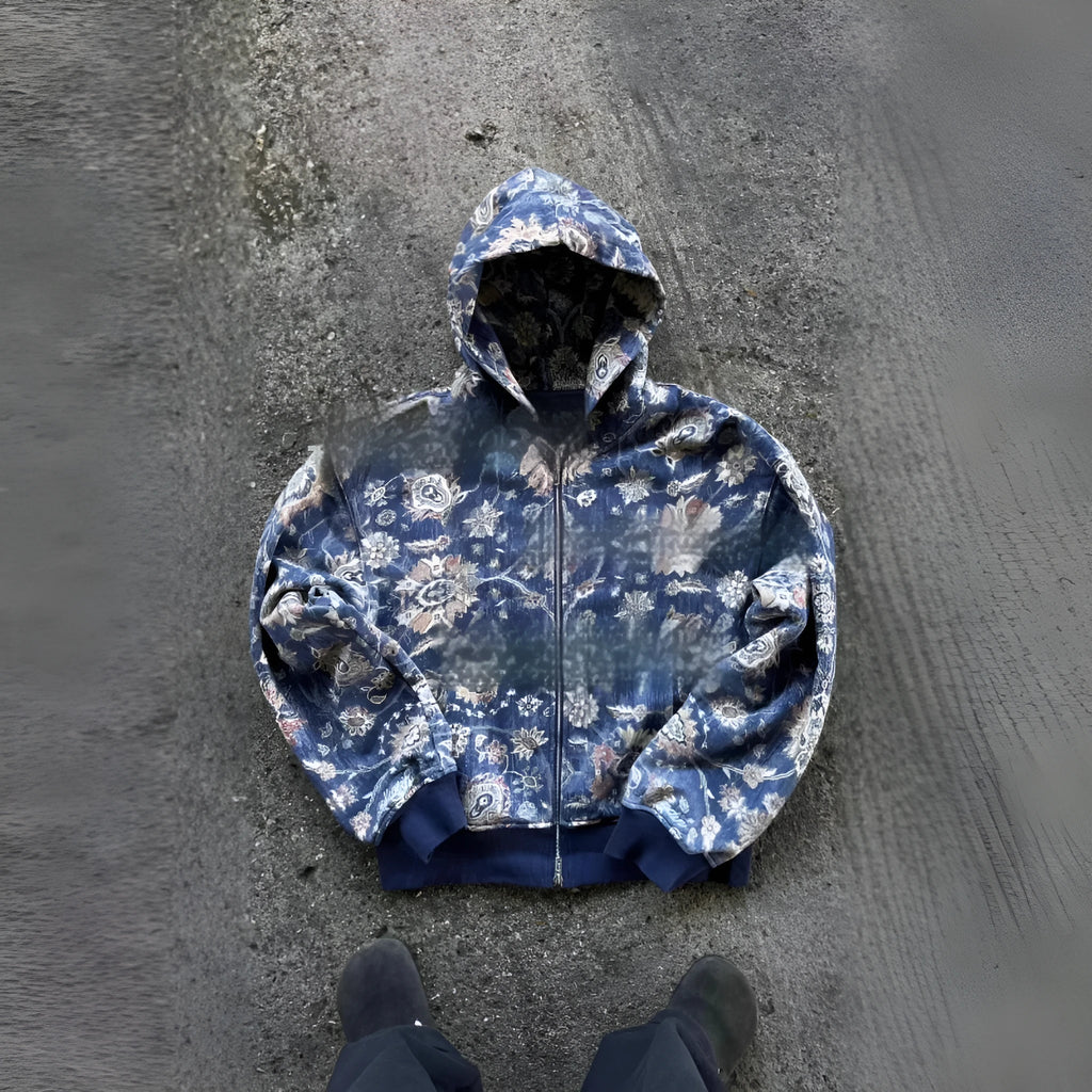 Man wearing a loose blue hooded zip-up coat with long sleeves for casual autumn wear.