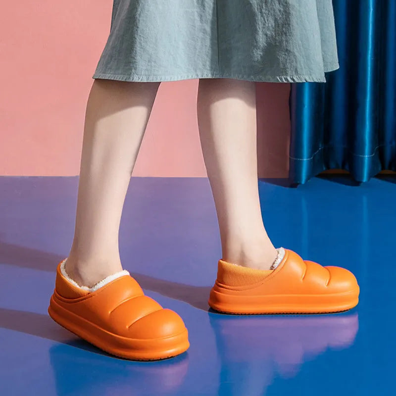 Waterproof EVA winter slippers with plush lining in multiple colours showing non-slip soles