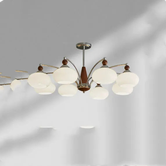 Traditional persimmon glass and chrome chandelier with multiple light heads for a dining room.