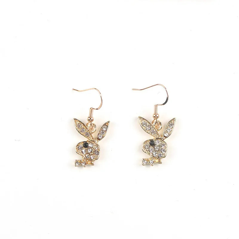 Silver, pink, and gold alloy stud earrings with a full diamond cartoon rabbit design.