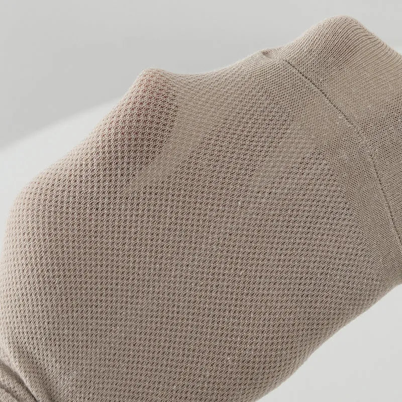 Low-cut polyester boat socks in solid colour on foot showing discreet design below ankle