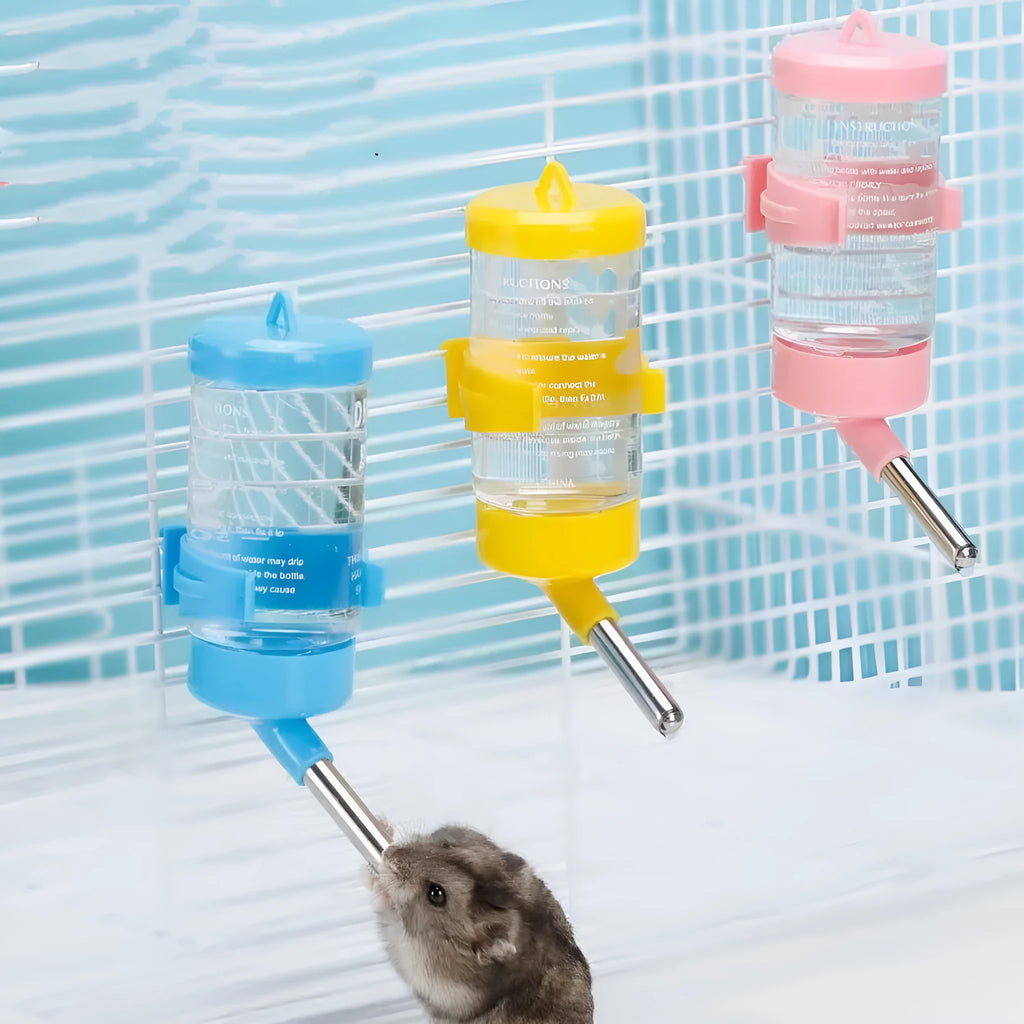 Green plastic ball kettle pet water feeder mounted on a small animal cage bars.