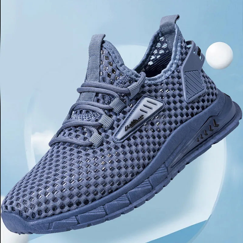 Men's beige mesh sneakers with lace-up front and synthetic leather upper on a flat EVA sole.