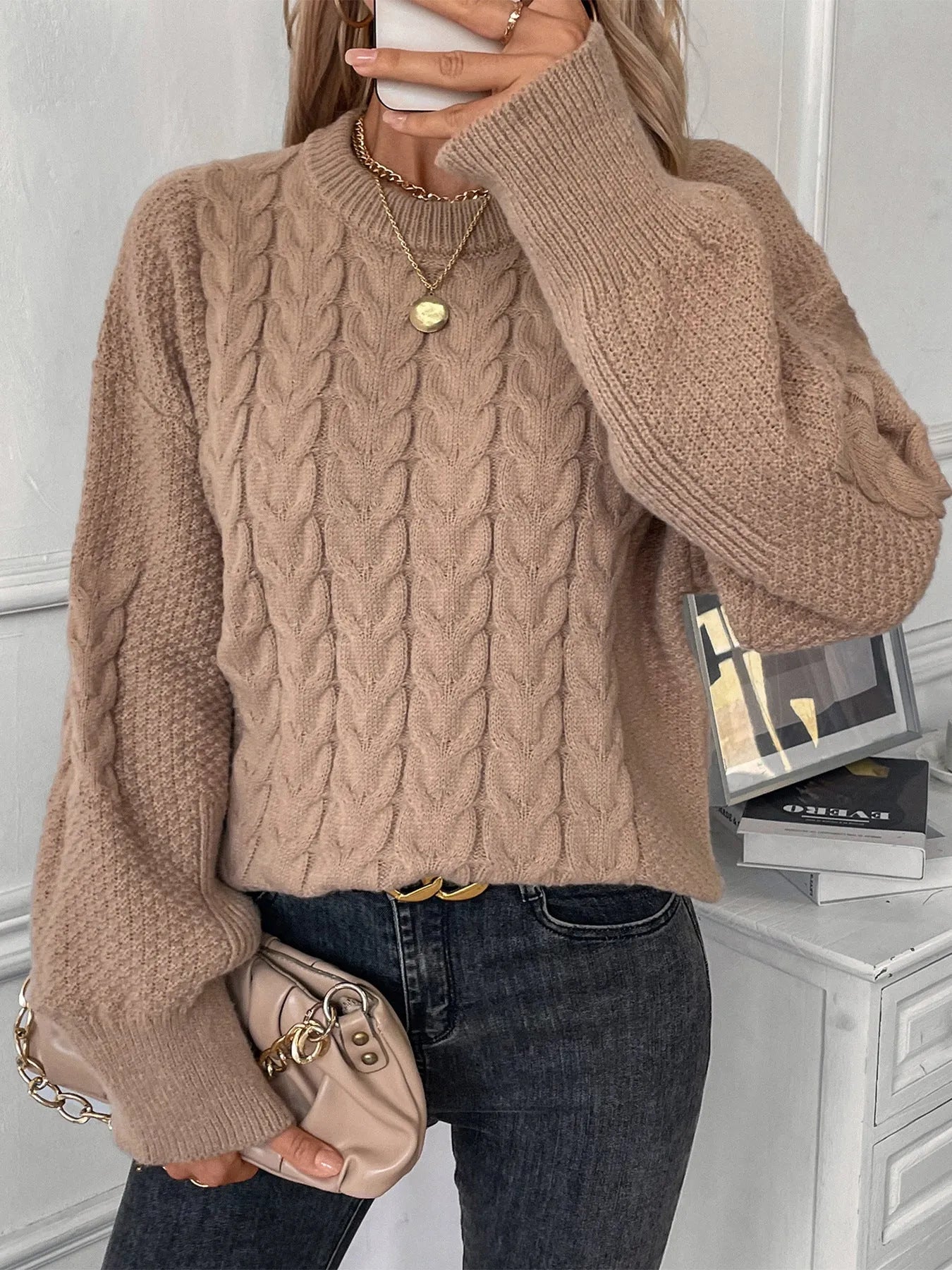 Women's khaki round neck sweater with twisted stitch detail and loose fit silhouette
