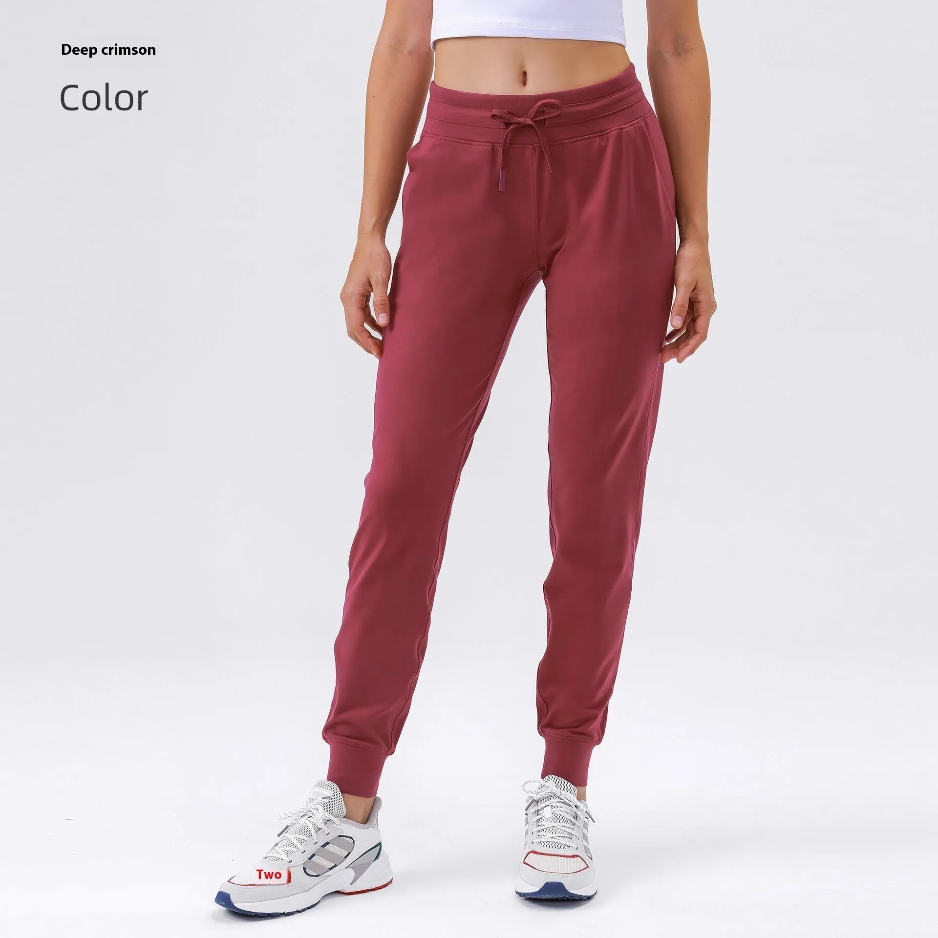 Women's high-waist yoga pants with drawstring waistband in a cotton blend fabric.