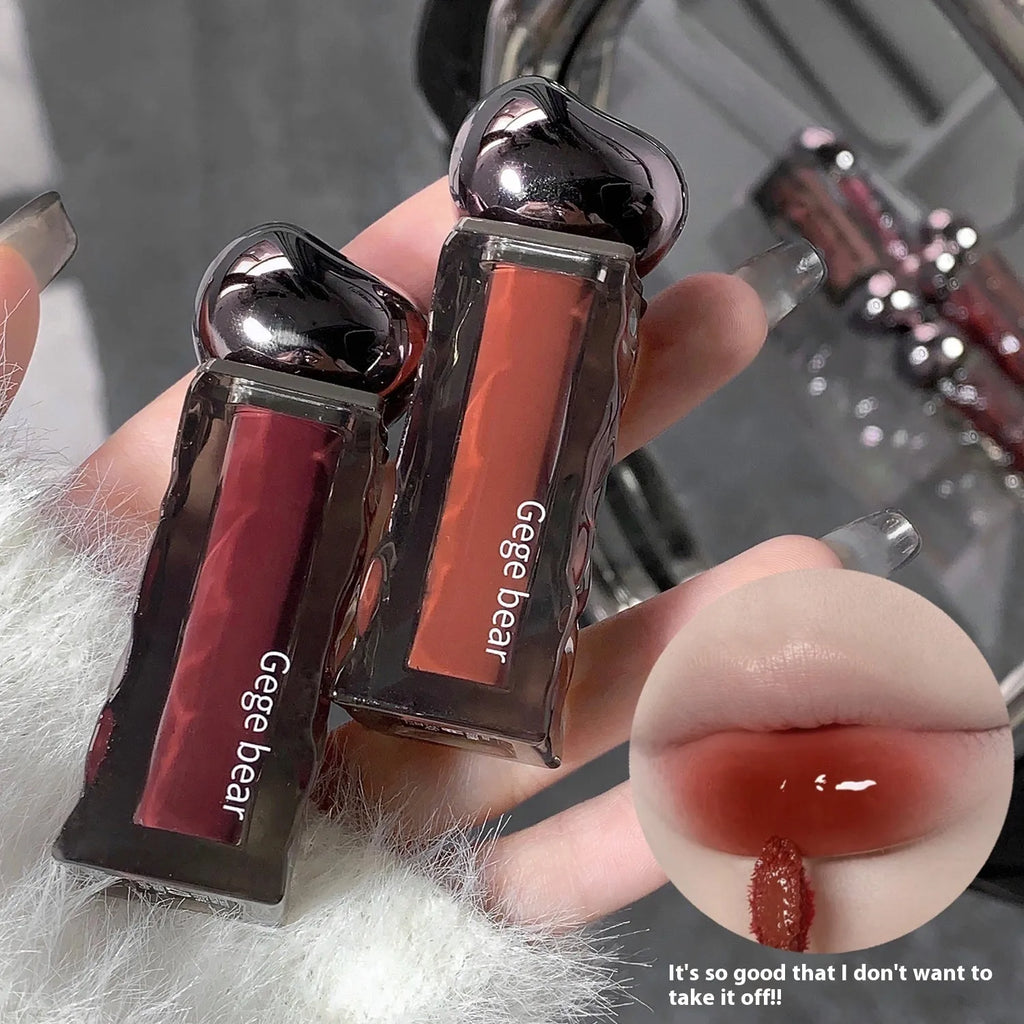 Glacier Lava mirror lip gloss tube with built-in mirror, shown in one of seven available shade numbers.