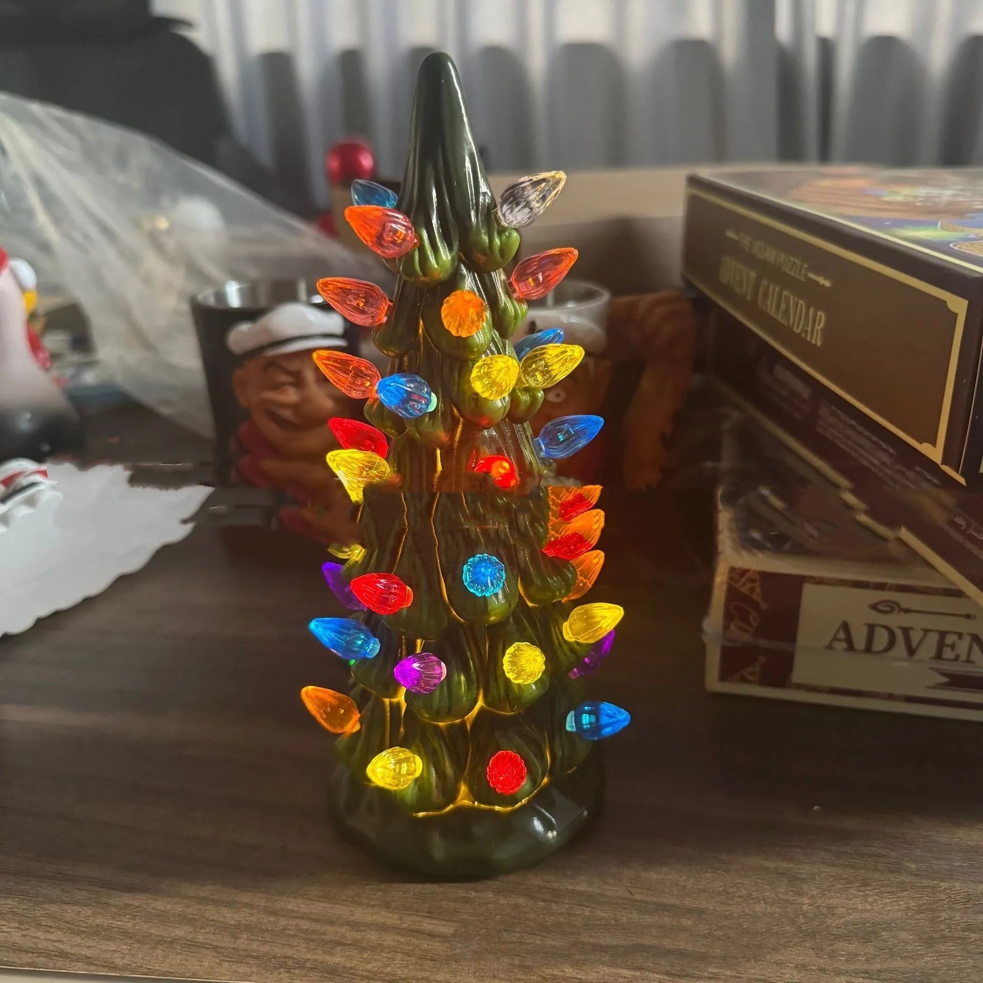 European-style Christmas tree ornament with lights, shown in different sizes for home or courtyard.