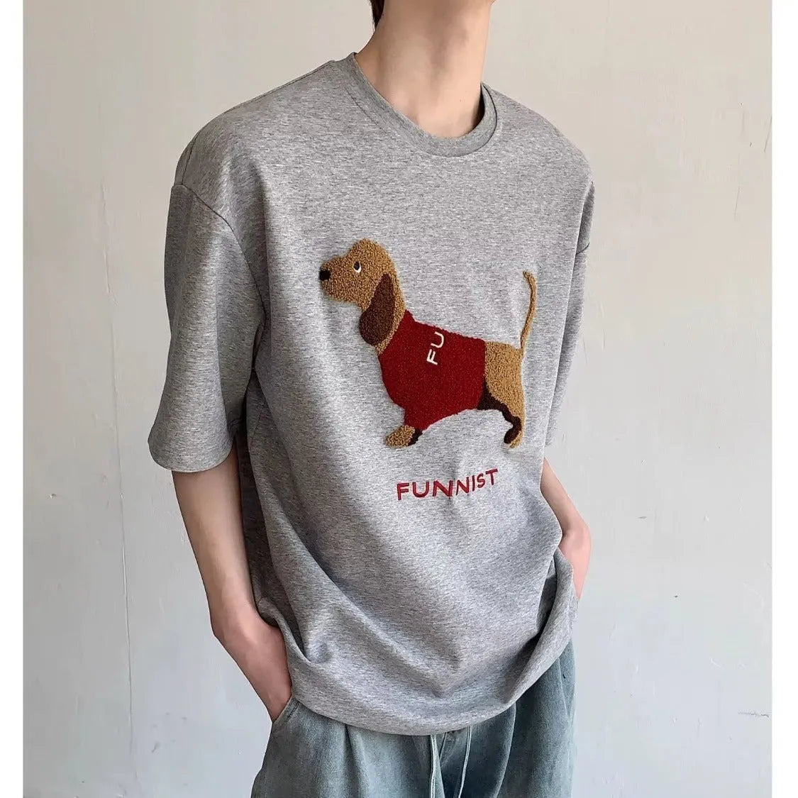 Men's grey cotton T-shirt with embroidered sausage dog design on the front.