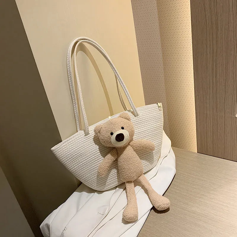 Cotton and linen woven bag with dumpling shape, double shoulder straps, and three-dimensional pocket