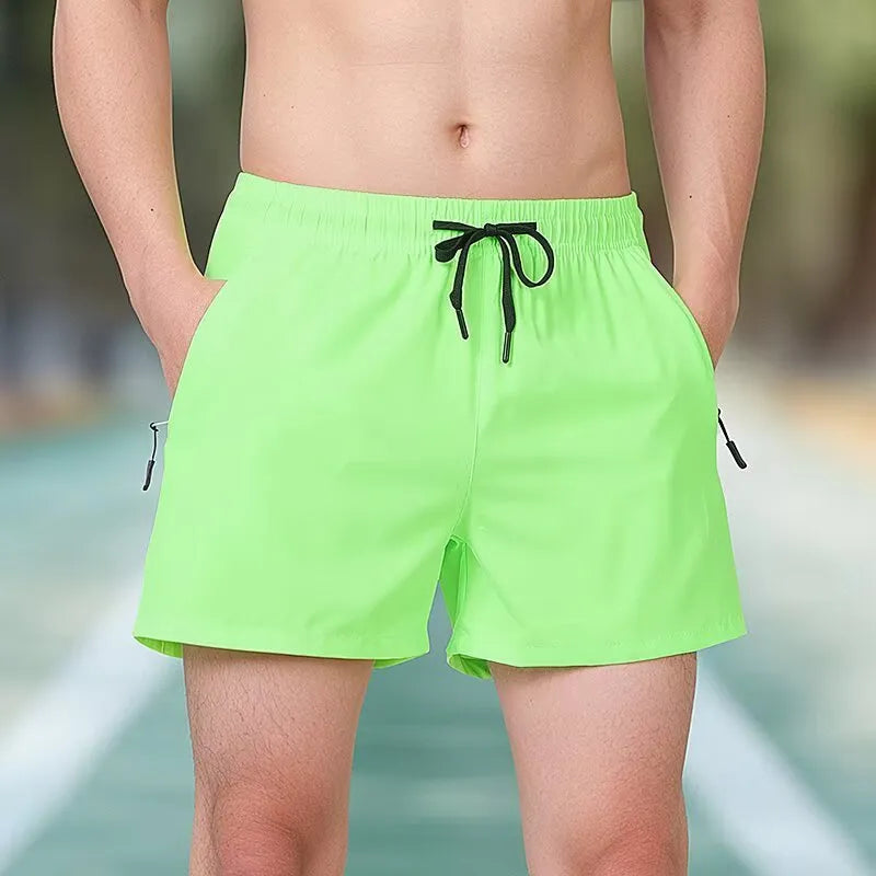 Black men's polyester fitness training shorts with a high waist and drawstring closure.