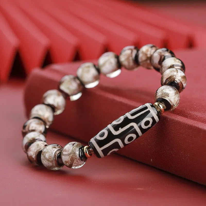 Chinese-style bracelet with colourful glazed beads showing snake patterns, available in 10mm 12mm or 14mm sizes