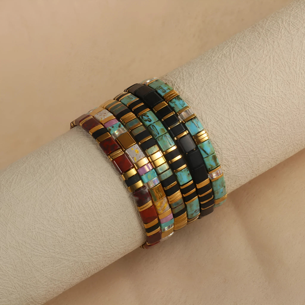 Geometric pull bead bracelet with round glass beads in multiple colour options.
