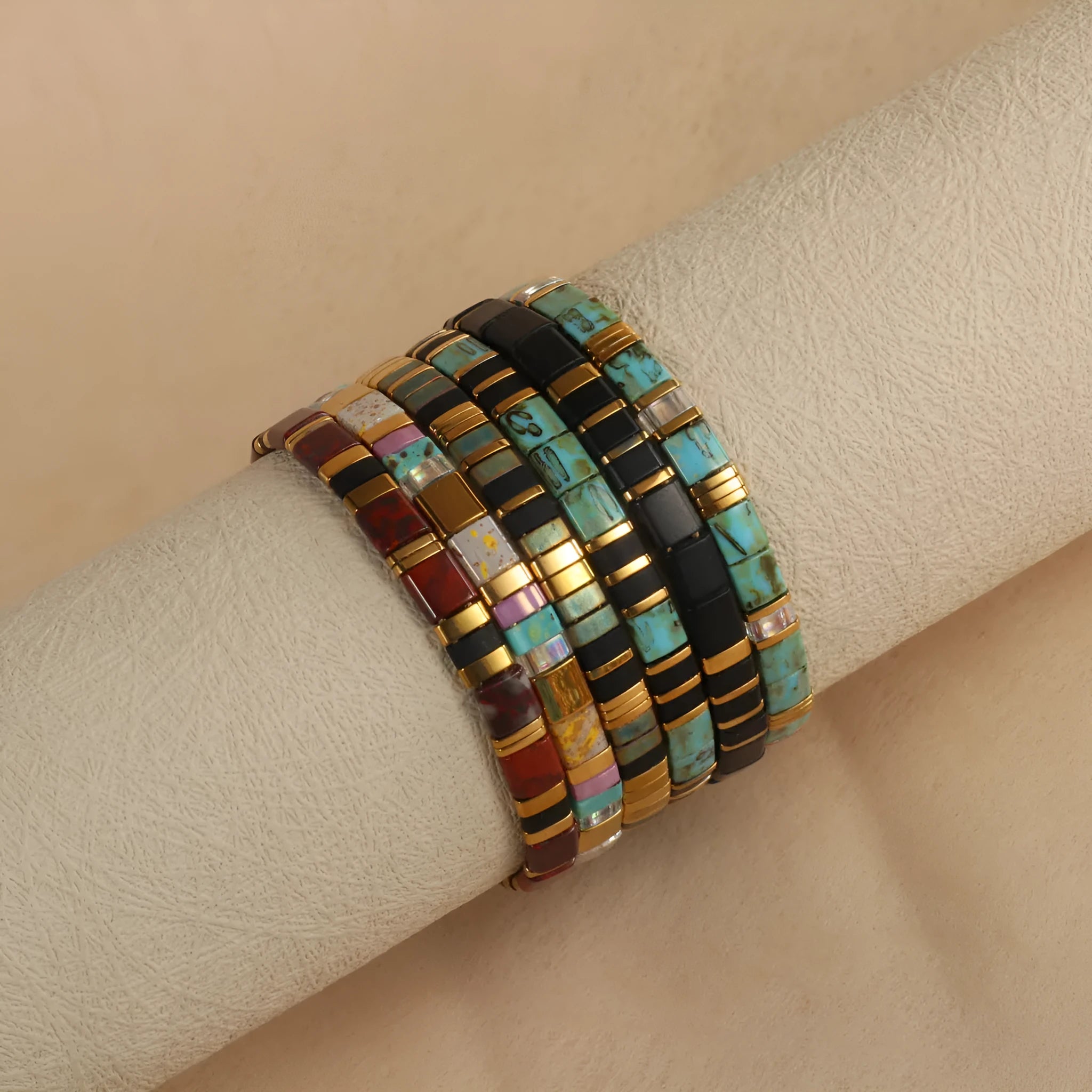 Geometric pull bead bracelet with round glass beads in multiple colour options.