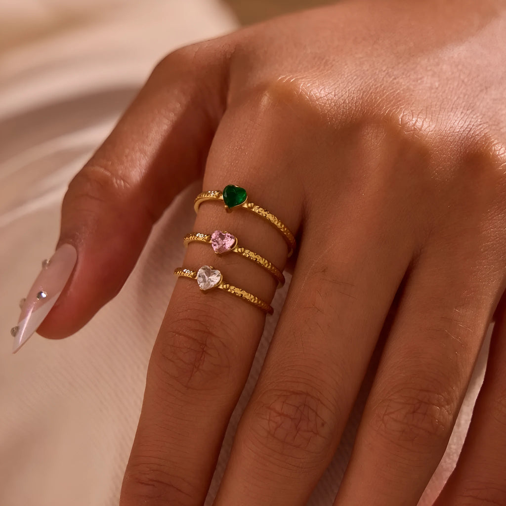 Geometric open-ended ring with heart-shaped zircon inlay in stainless steel