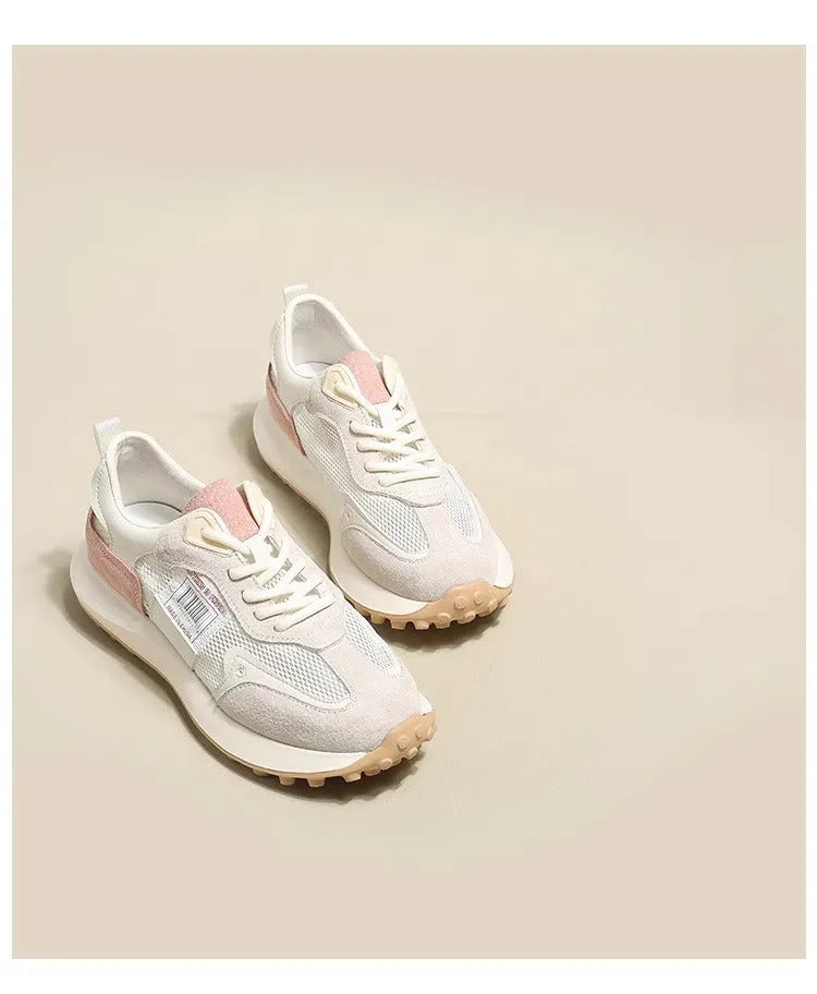 Women's low-top retro sneaker in grey with round toe, rubber sole, and mesh lining.