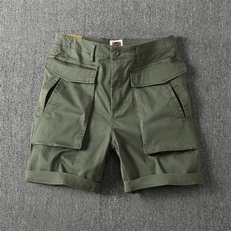 Men's stretch cotton cargo shorts in army green showing multiple pockets and straight-leg fit.