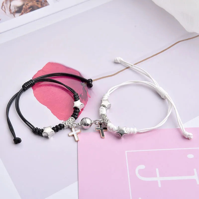 Alloy couple bracelets with magnet closure showing various design options including crown, clover, and text patterns