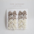 Children's fabric dovetail bow hair clips in eight pattern options