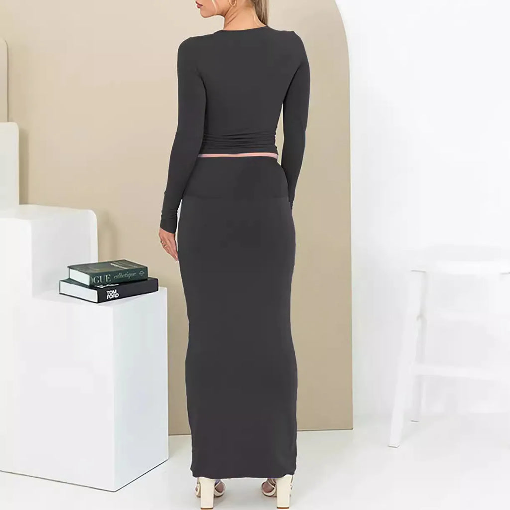 Women's black sweet style polyester two-piece suit with exposed navel and three-quarter sleeves.
