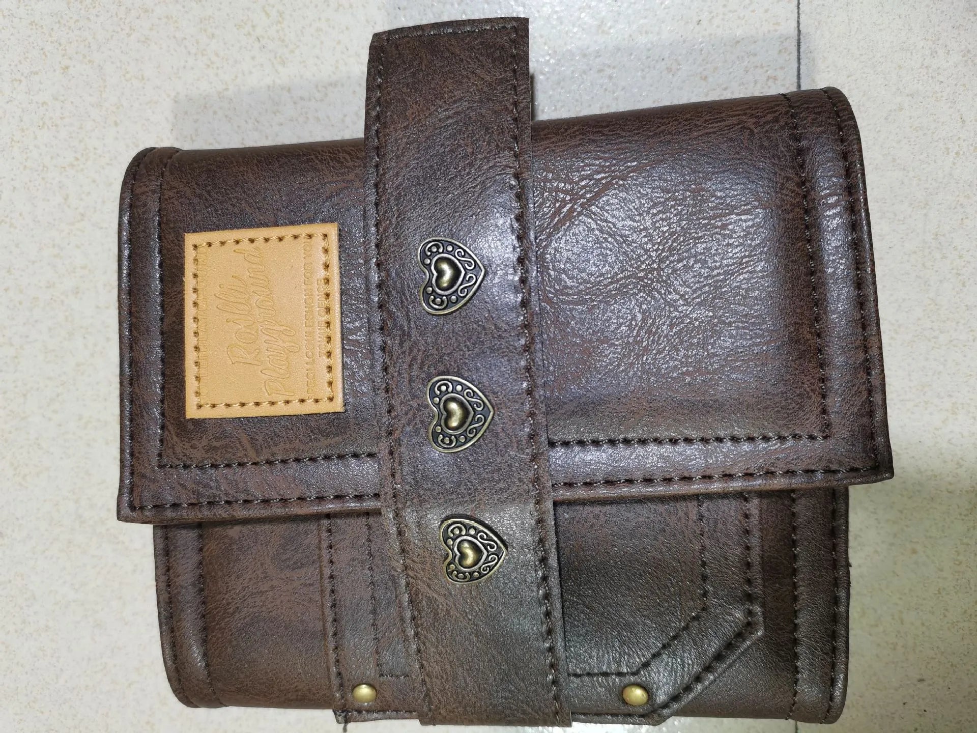 Brown retro leather buckle notebook with loose-leaf binder binding, A7 size with raw wood pulp paper