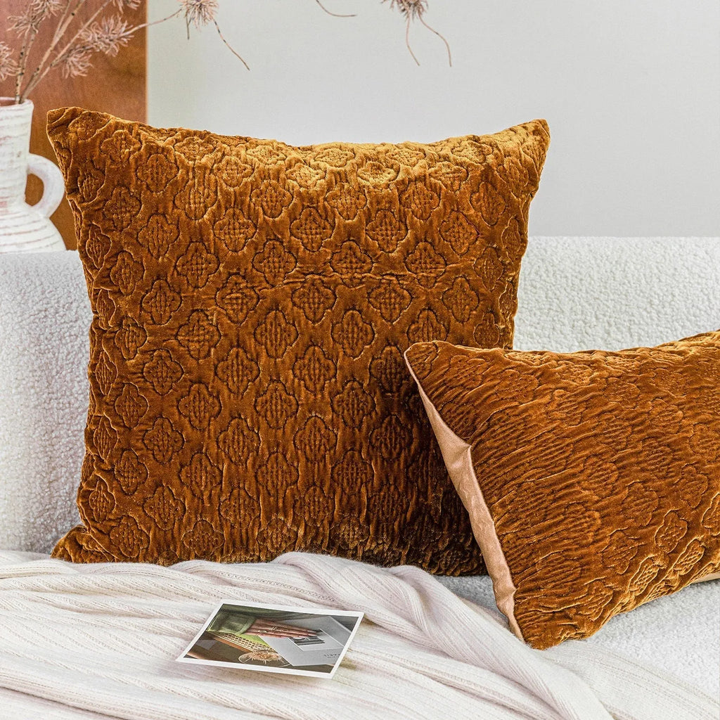 Brown gold antique-style three-dimensional quilted cushion pillow on a sofa