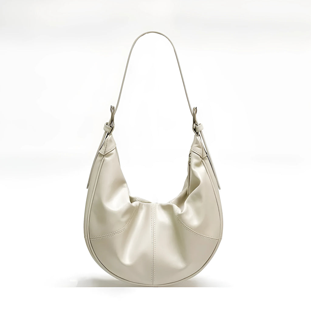 Women's soft cowhide leather dumpling-shaped shoulder bag in black with double straps and sandwich pockets.