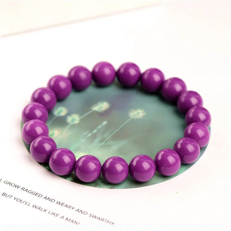 Jiuya original design purple mica crystal bracelet on a wrist, showing polished beads in a single circle.