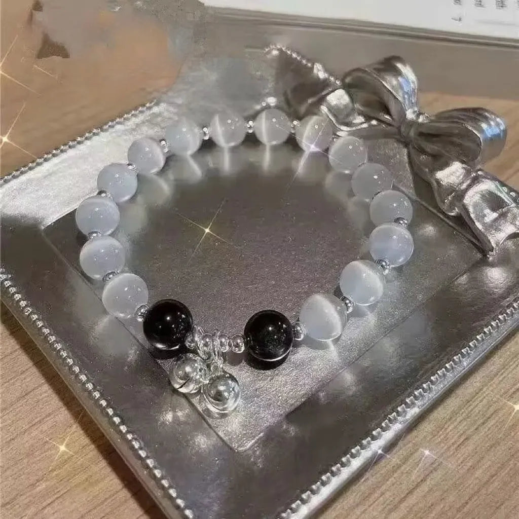 Handcrafted grey moonlight glass butterfly bracelet with coloured glaze beads and round charms