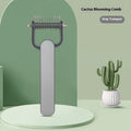 Dog grooming comb with stainless steel teeth and plastic handle in green or grey colour