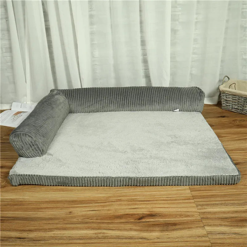 Corduroy pet sofa dog bed in grey, showing bilateral raised edges and non-slip base.